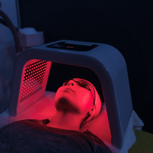 Woman going under Dermalux Light Therapy